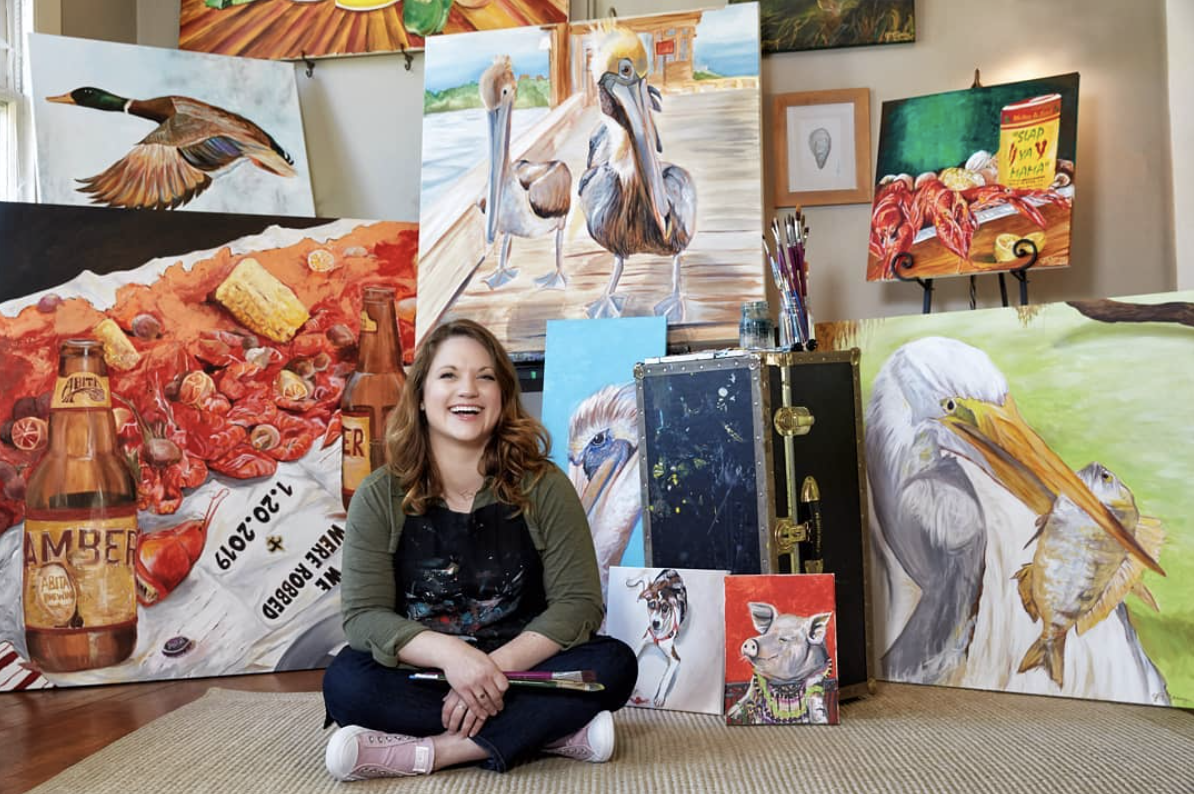 painter jessica young with art behind her
