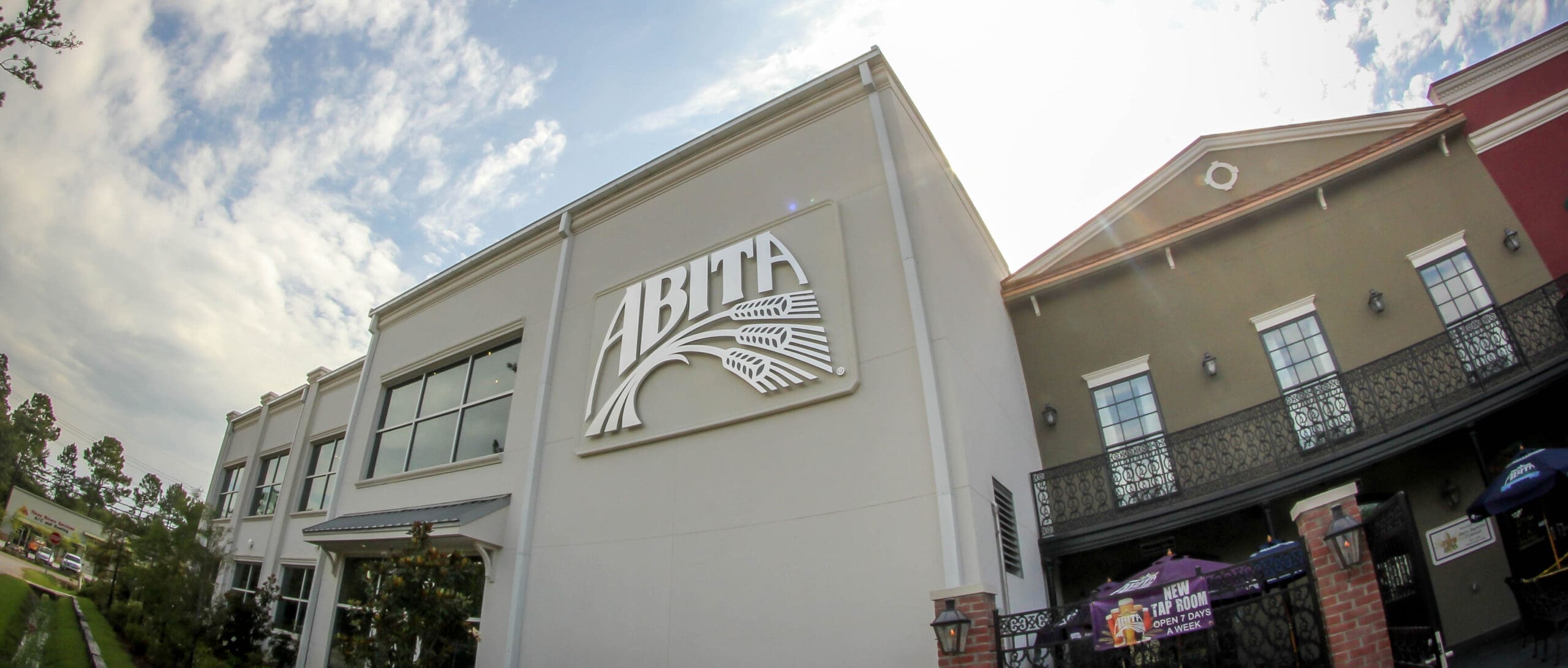 street view of the outside of the abita brewery with abita logo at the center