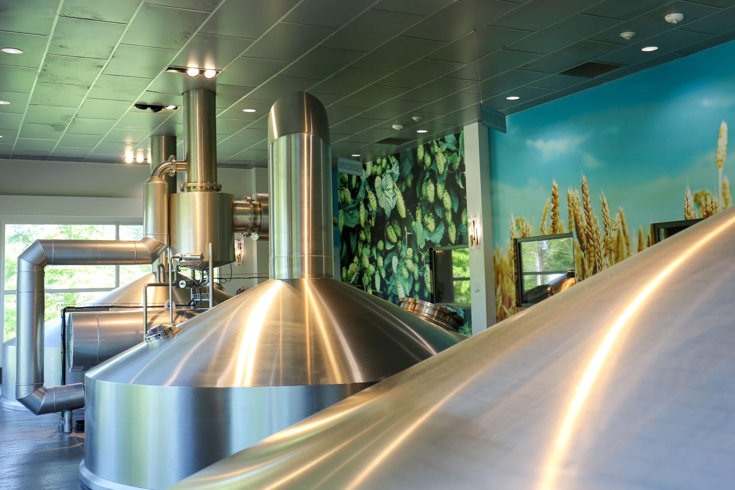 top of beer tanks in the brewhouse mezzanine at abita brewing company