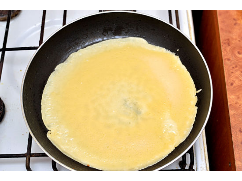 pancakes cooking on a pan on the stove made with abita beer