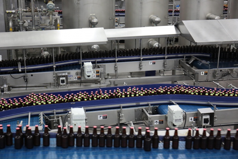 bottled ready to drink private label cocktails on a manufacturers conveyor belt