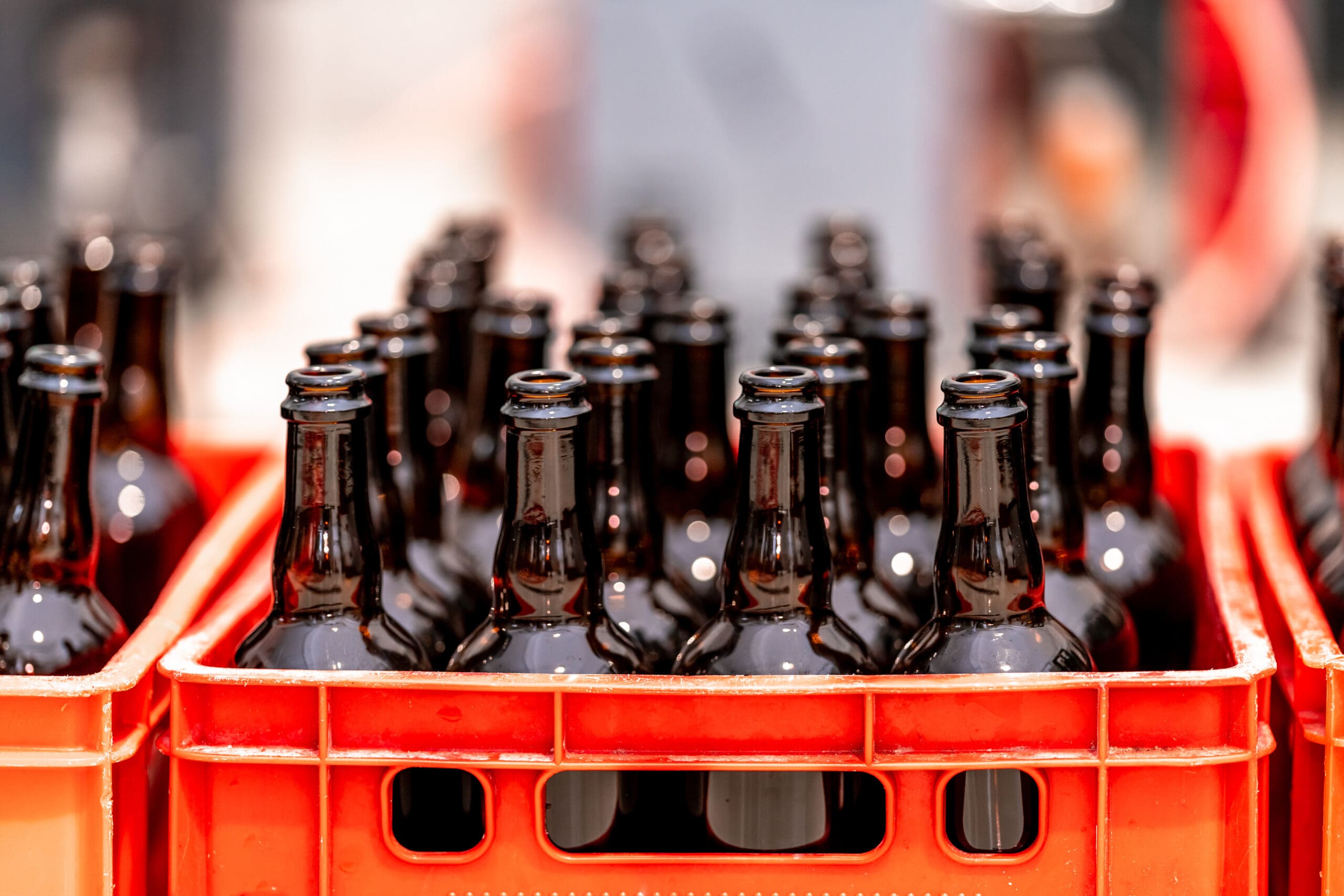 red crate full of glass bottles