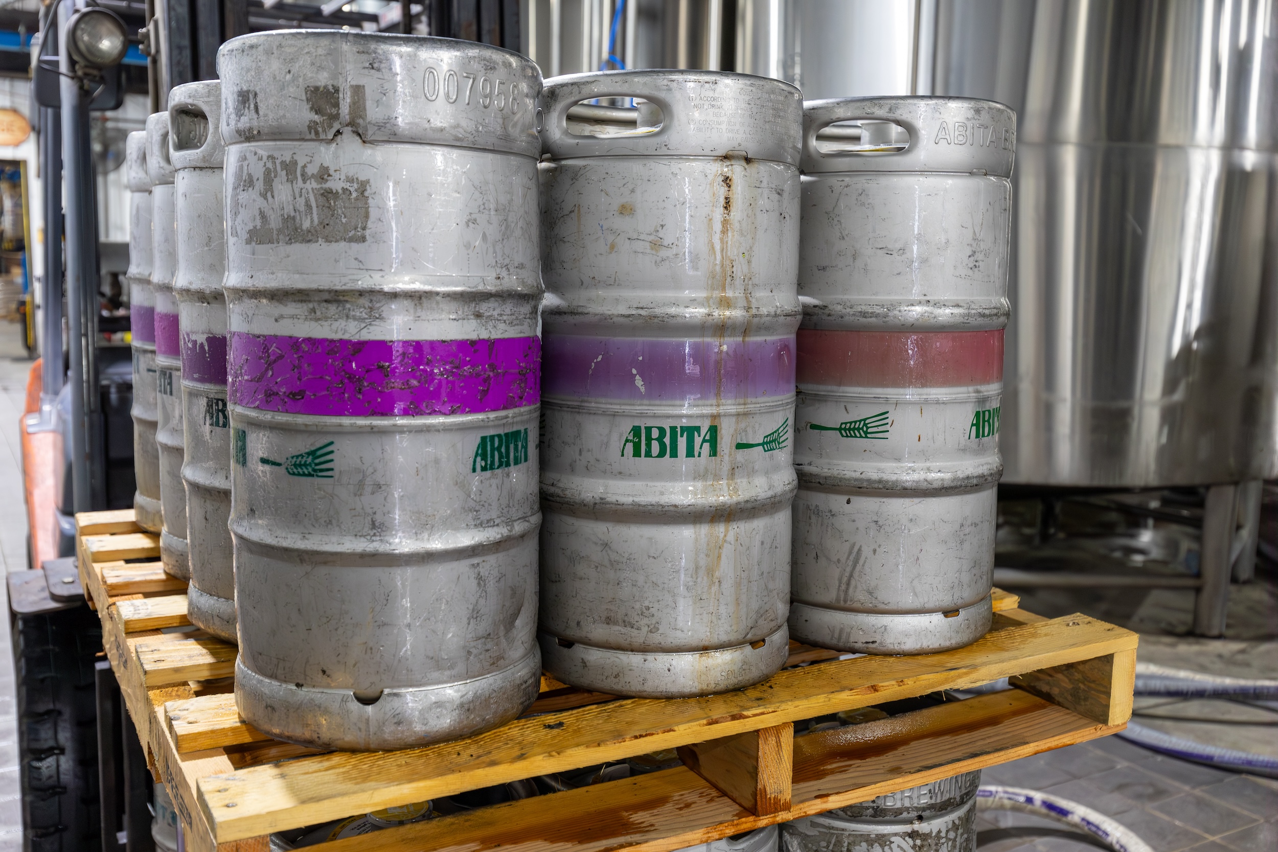 kegs of beverages sitting on a pallet